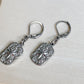 Boucles d’oreilles minimalistes Estrella en acier inoxydable argenté avec motif étoile scintillant